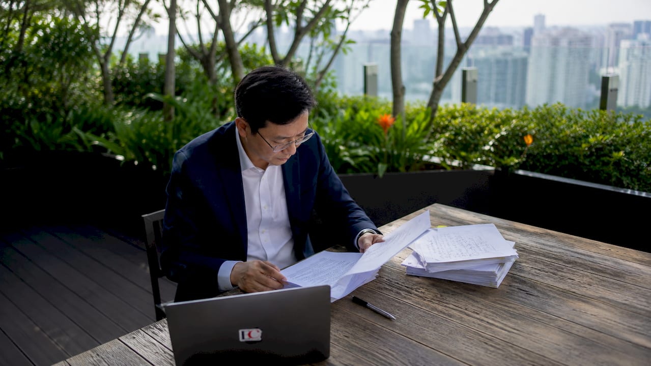 Singapore MAS regulations explained: your 2026 guide 1 Compliance officer reviewing MAS regulations at desk